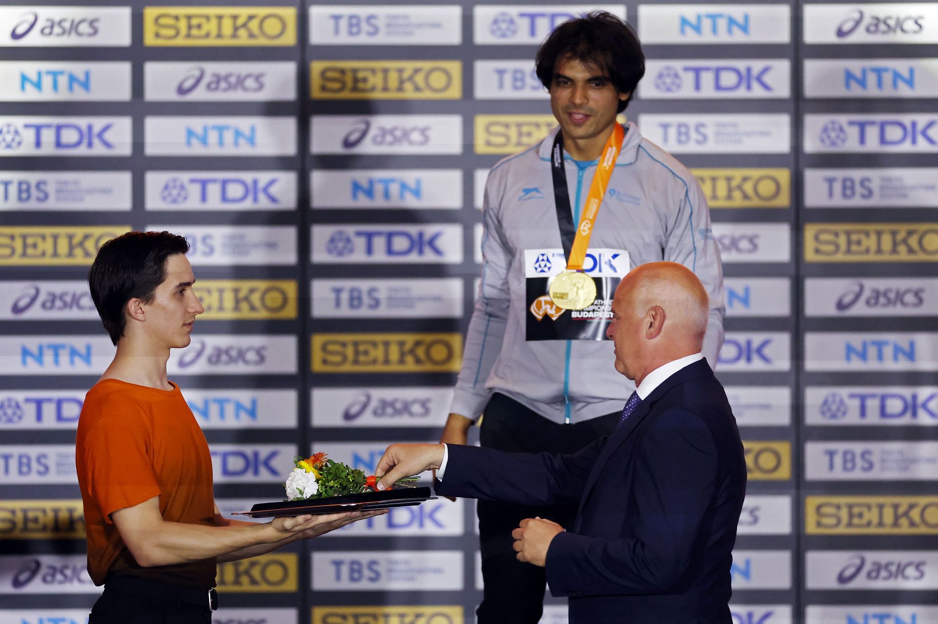 Neeraj Chopra being presented with gold medal at World Athletics Championships Budapest 2023