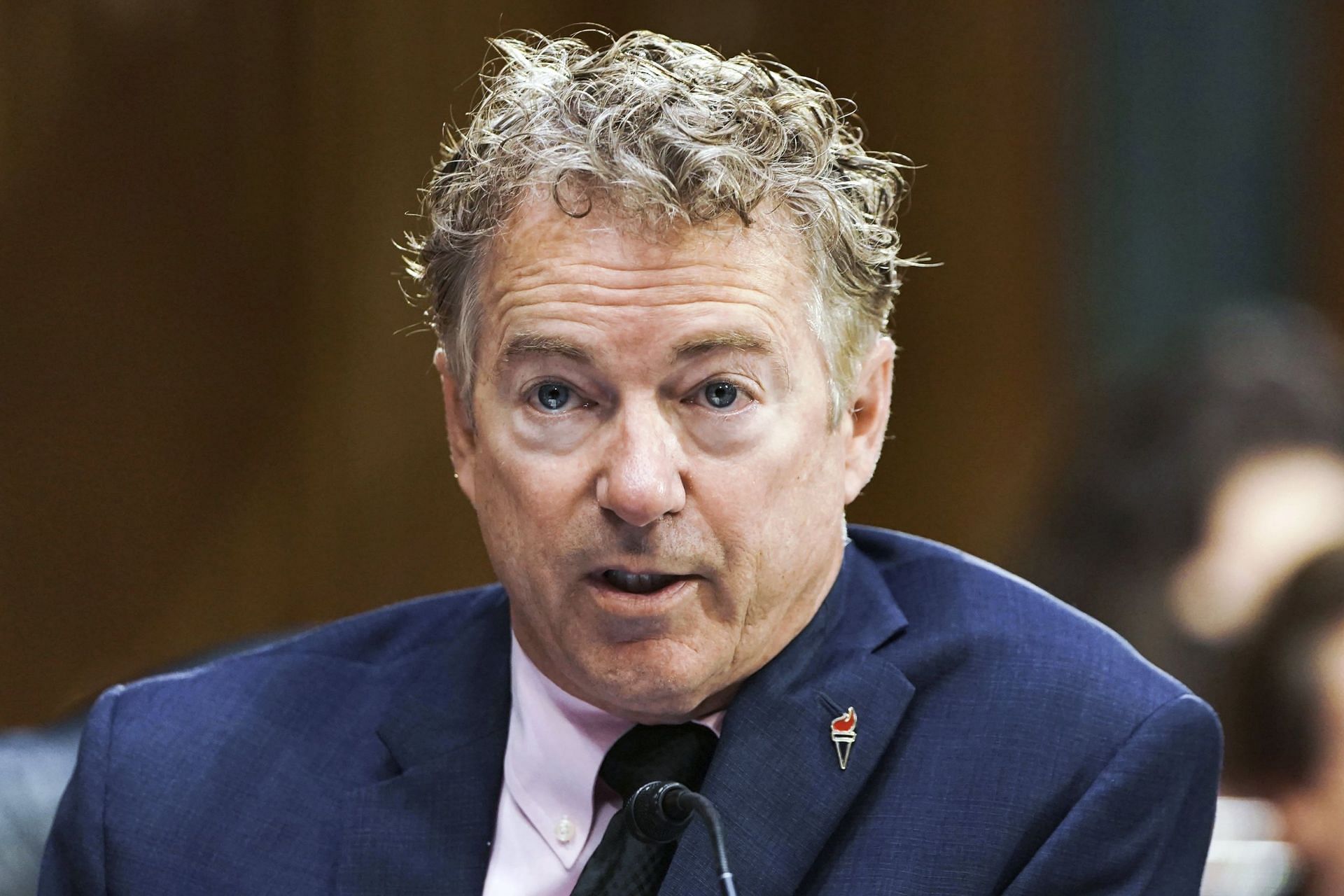 Details revealed about Heimlich Maneuver as Sen. Rand Paul saves Sen. Joni from choking. (Image via @WhisperingVio /X)