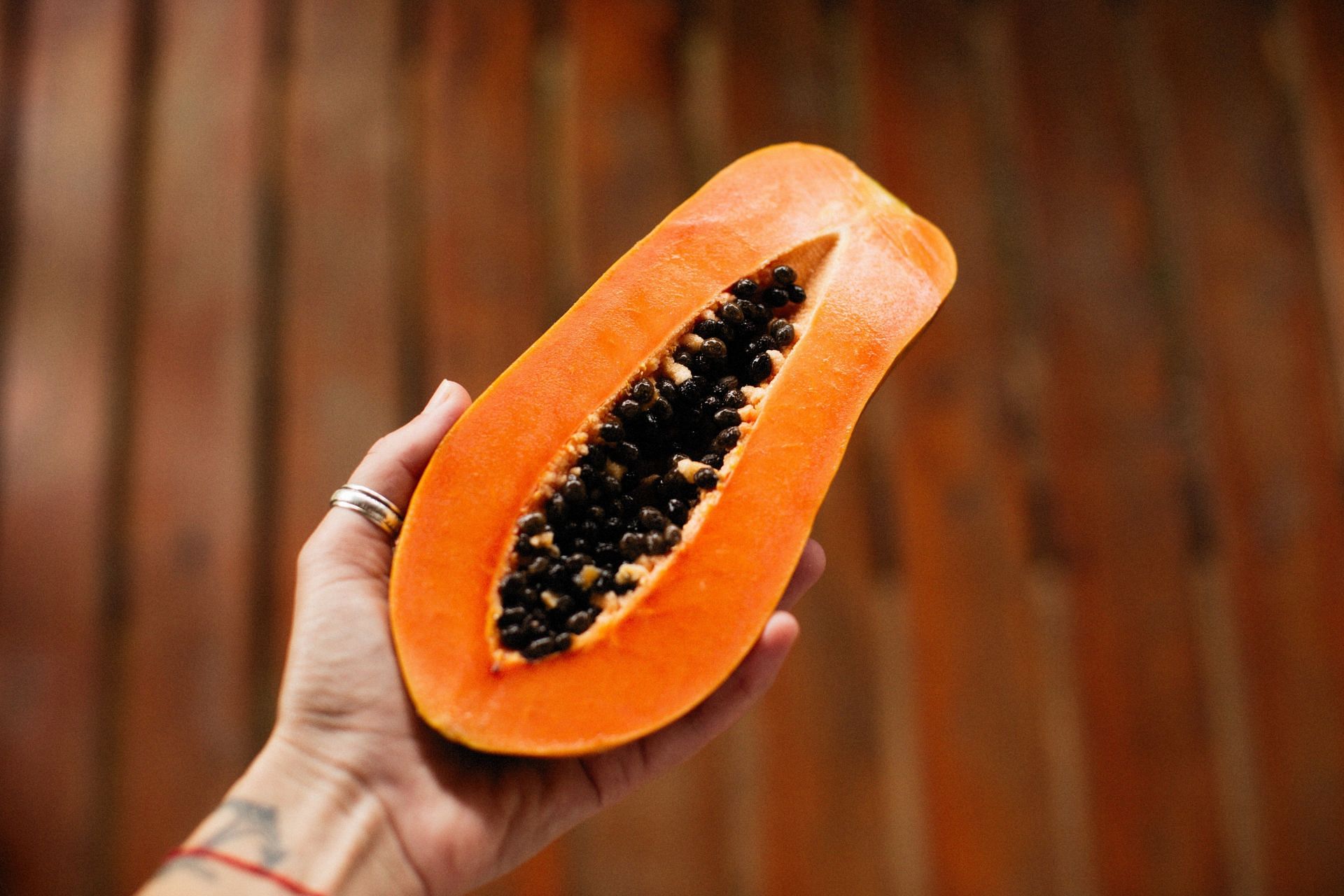 Papaya for constipation can help ease stomach pain (Image via Unsplash/ Alexey Demidov)