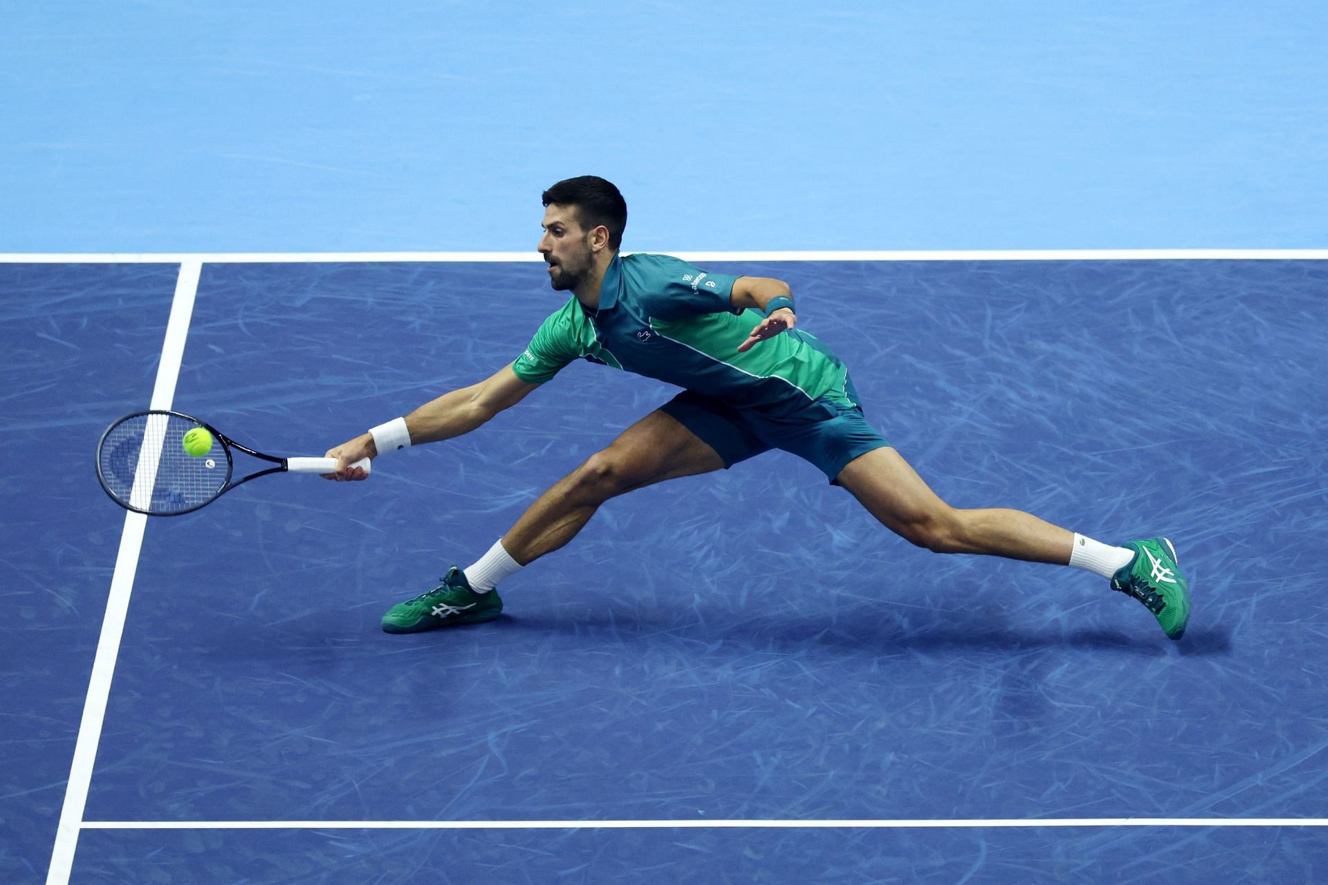 Novak Djokovic does a split to get the ball at Nitto ATP Finals 2023