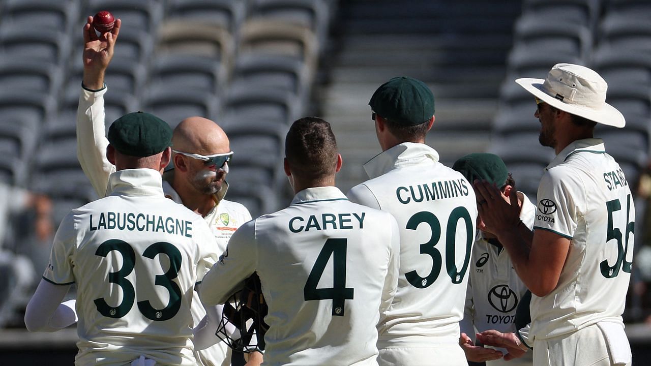 Australian players celebrate Nathan Lyon