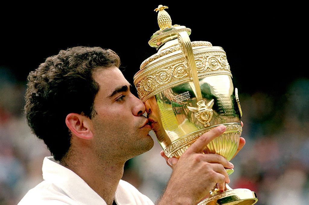 Pete Sampras kisses the 1997 Wimbledon trophy