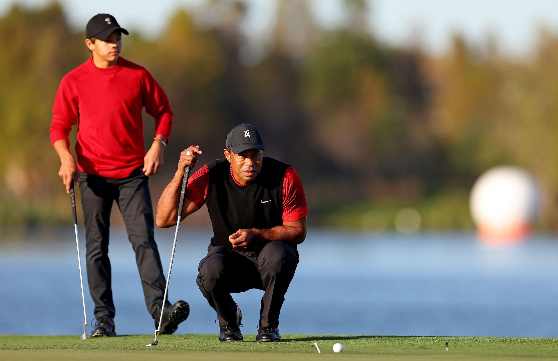 Tiger and Charlie Woods (Image via Getty)