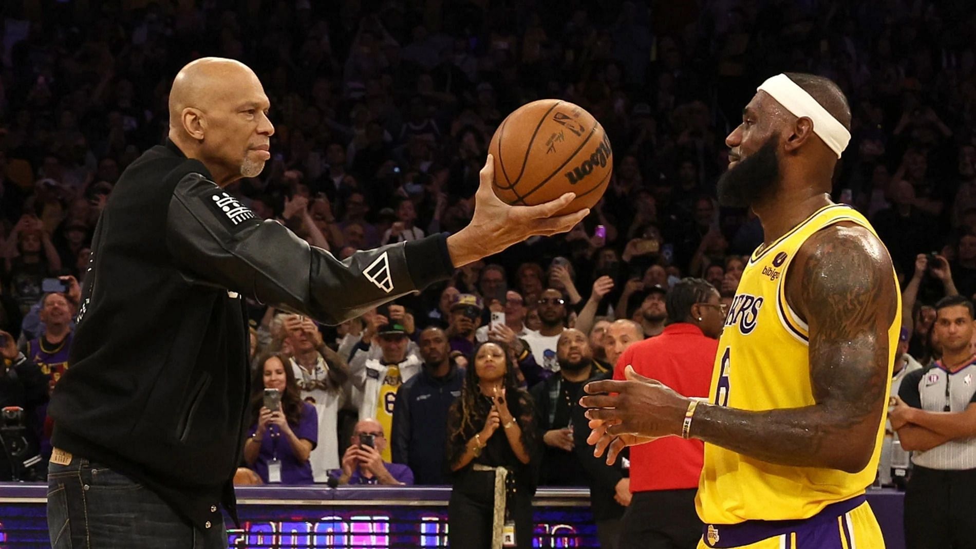 LeBron James, left, surpasses Kareem Abdul-Jabbar, right.