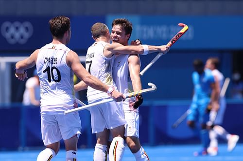 Cedric Charlier and John-John Dohmen celebrate a goal against India at Tokyo 2021