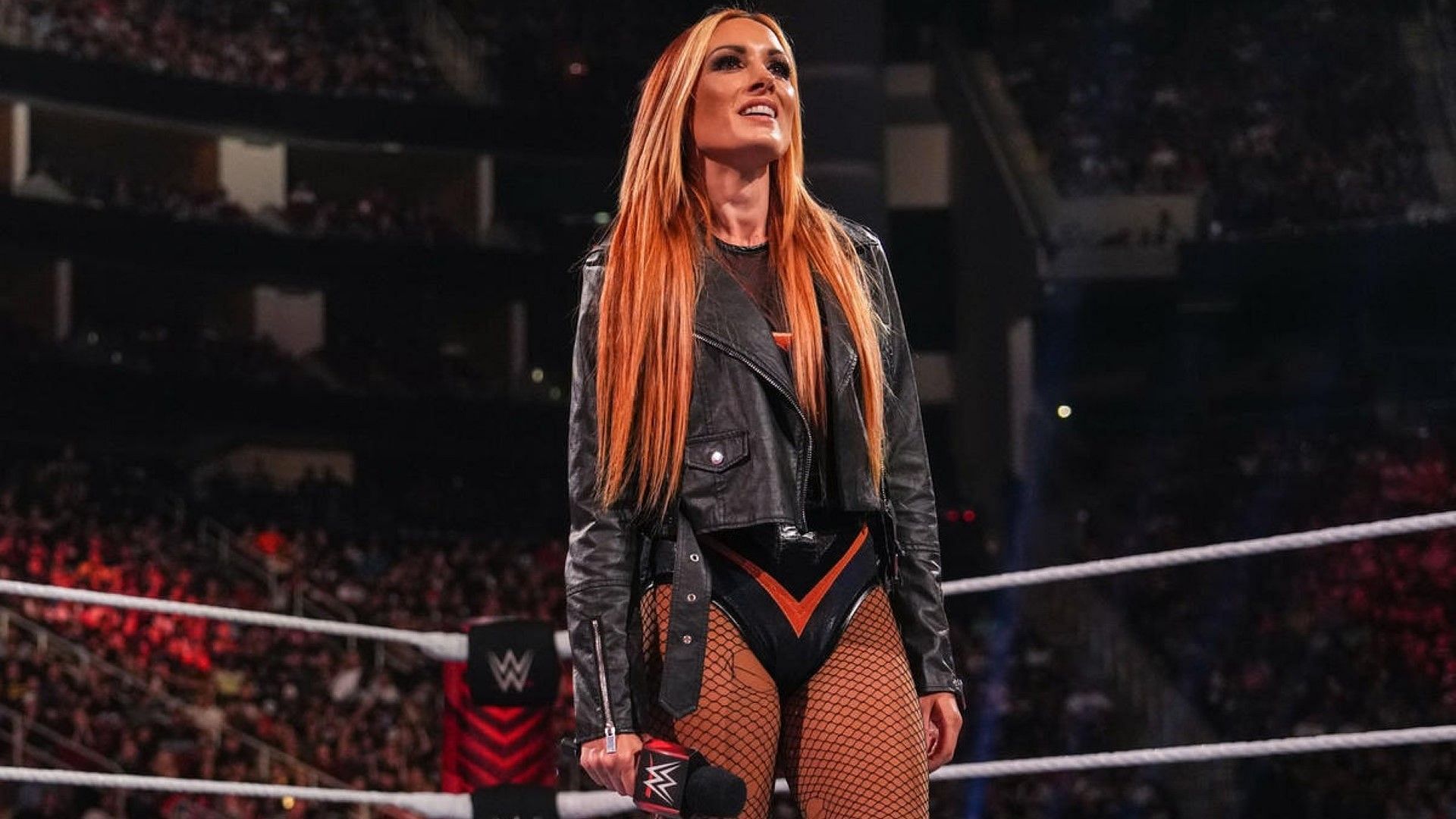 Becky Lynch stands with the mic on WWE RAW