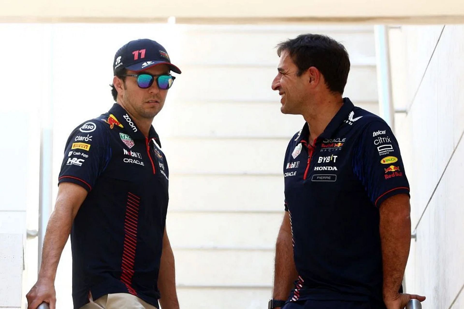Sergio Perez talks with Pierre Wache at Red Bull Racing in the paddock prior to practice ahead of the 2023 F1 Qatar Grand Prix. (Photo by Clive Rose/Getty Images)
