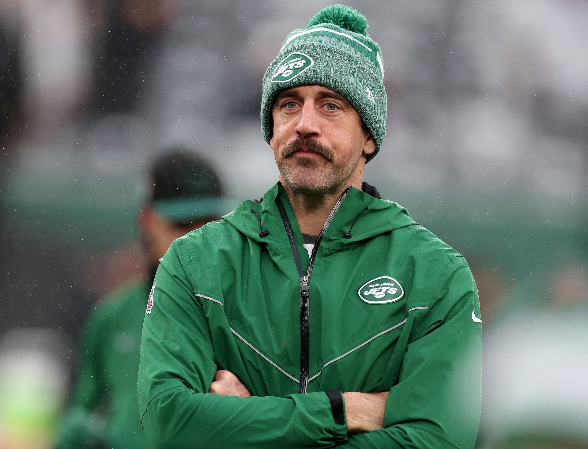 Aaron Rodgers watches the New York Jets-Atlanta Falcons game