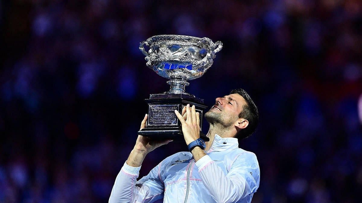 Novak Djokovic poses with the 2023 Australian Open trophy