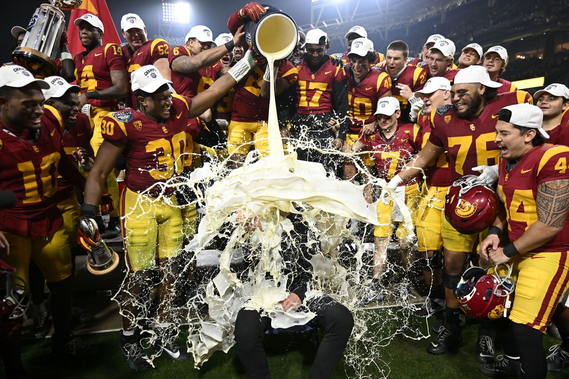 Watch USC’s Lincoln Riley gets drenched in creamy eggnog soak after