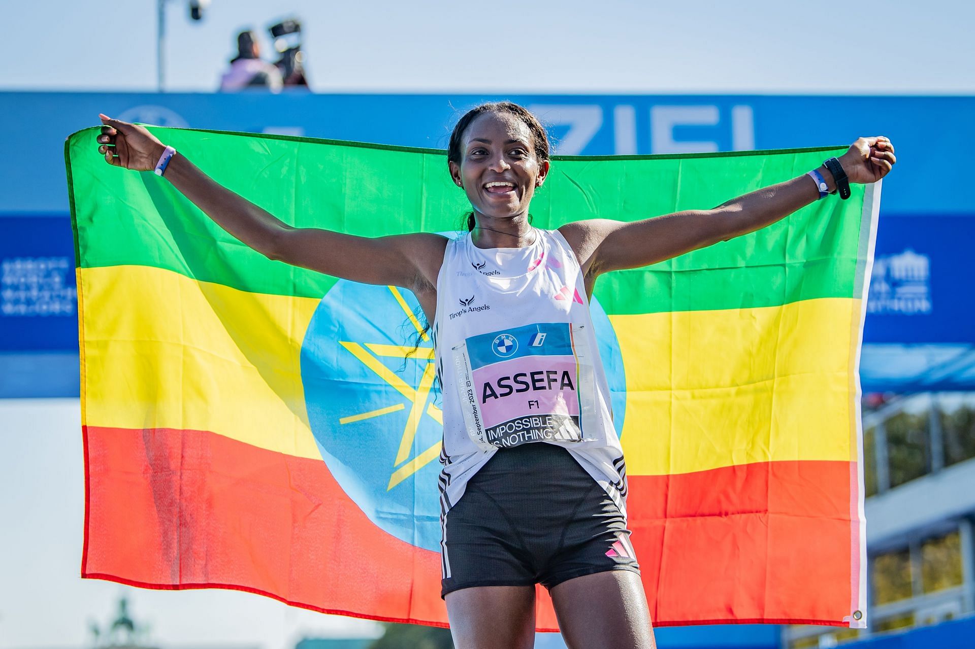 Tigist Assefa from Ethiopia celebrates after crossing the finish line during the 2023 BMW Berlin Marathon in Germany.