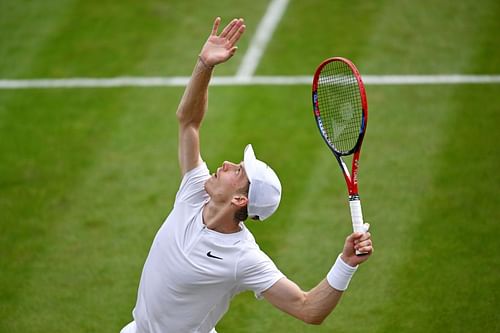 Denis Shapovalov of Canada serves against Roman Safiullin in the Men's Singles fourth-round match during day seven of The Championships Wimbledon 2023