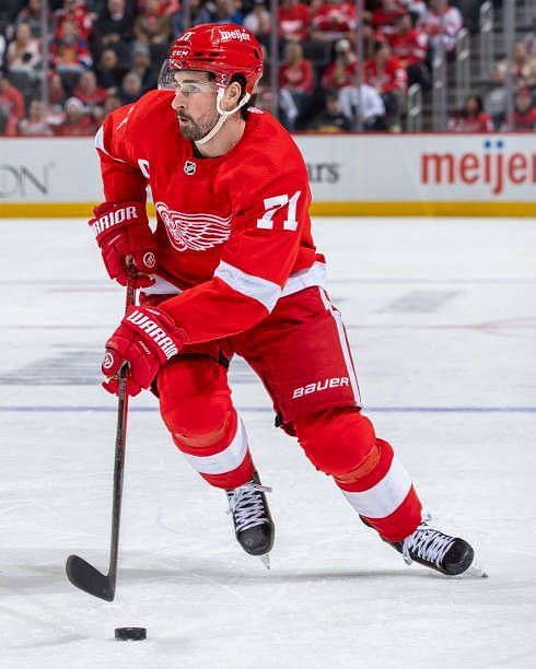 Dylan Larkin of the Detroit Red Wings skates up ice with the puck against the Philadelphia Flyers during the third period at Little Caesars Arena on...