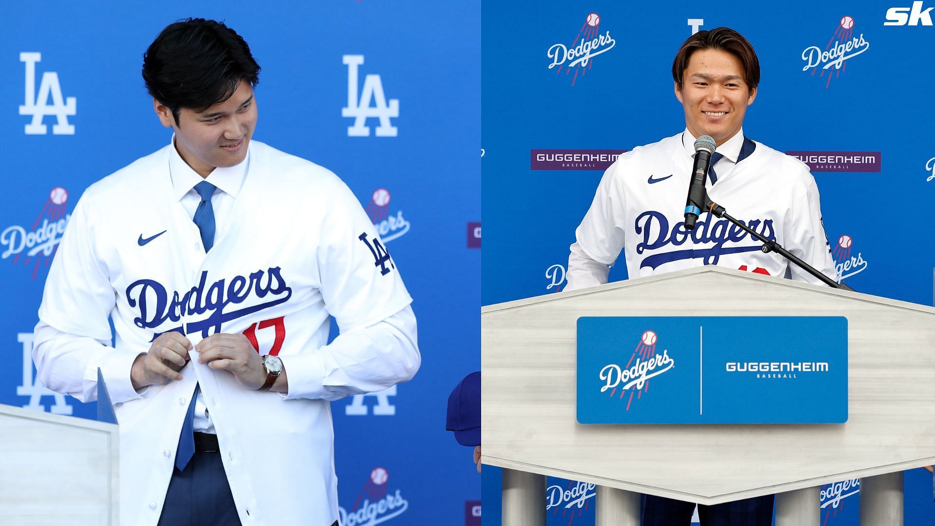 Yoshinobu Yamamoto puts his jersey on for the first time during an introductory press conference at Dodger Stadium