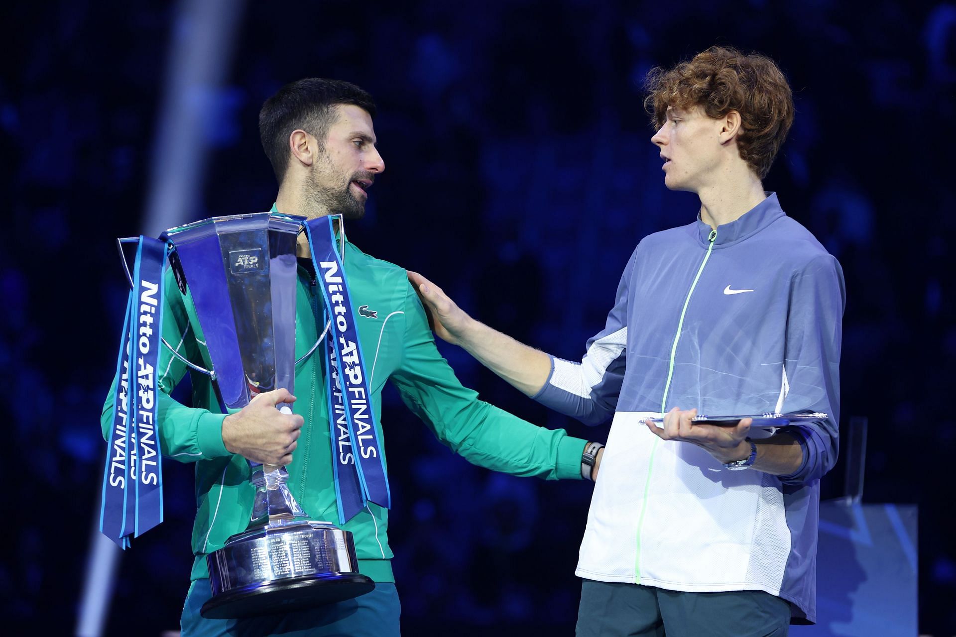 Novak Djokovic (L) and Jannik Sinner congratulate each other