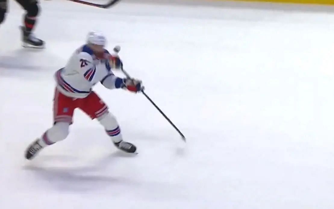 Rangers forward Barclay Goodrow receiving a puck to the pace