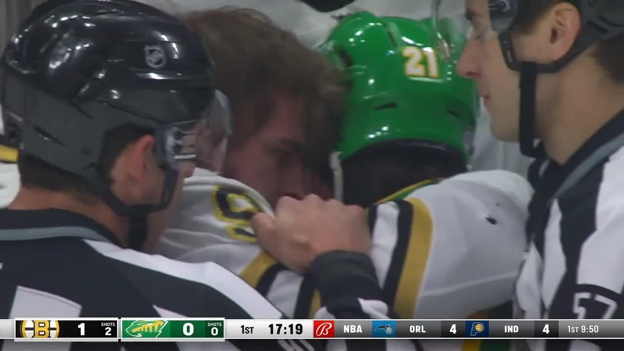 Brandon Duhaime and Jakub Lauko face off in the first period of a game between the Bruins and Wild