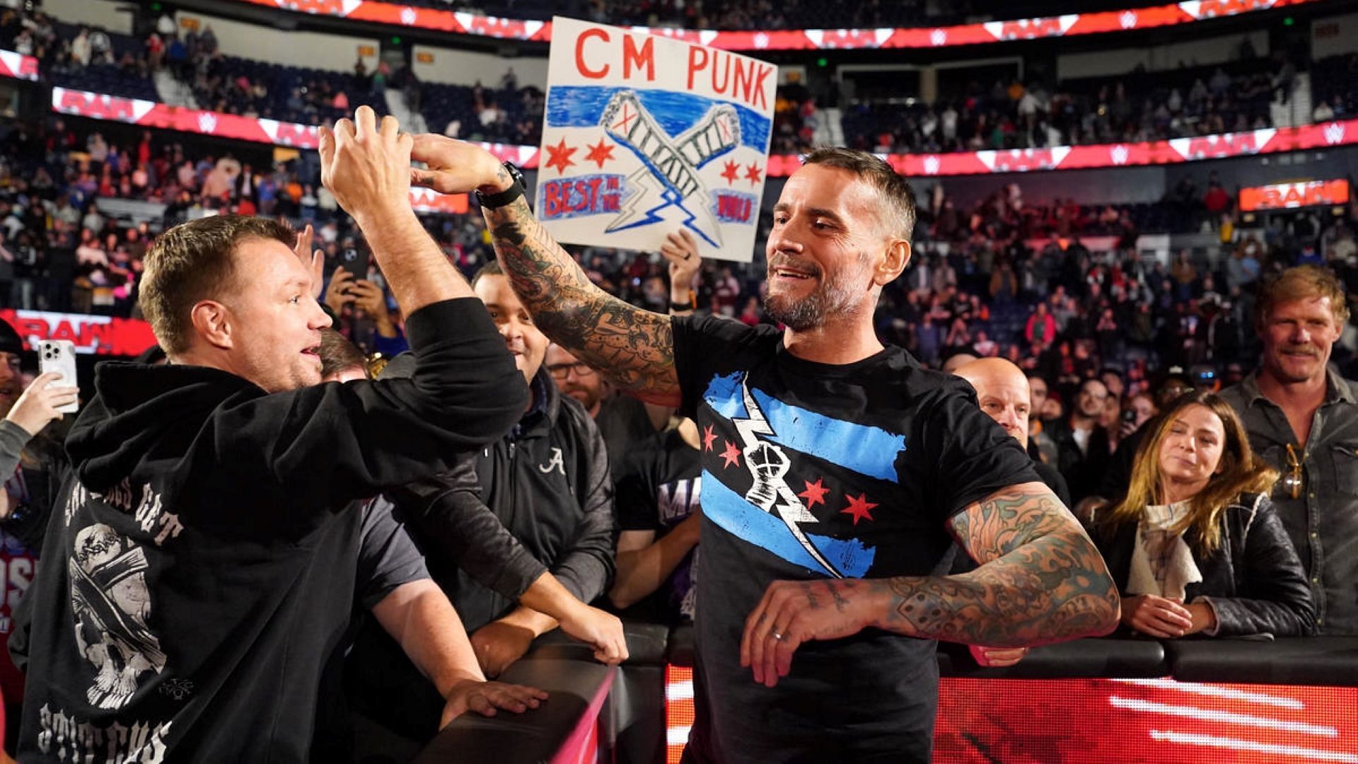 CM Punk greets WWE fans ringside at RAW