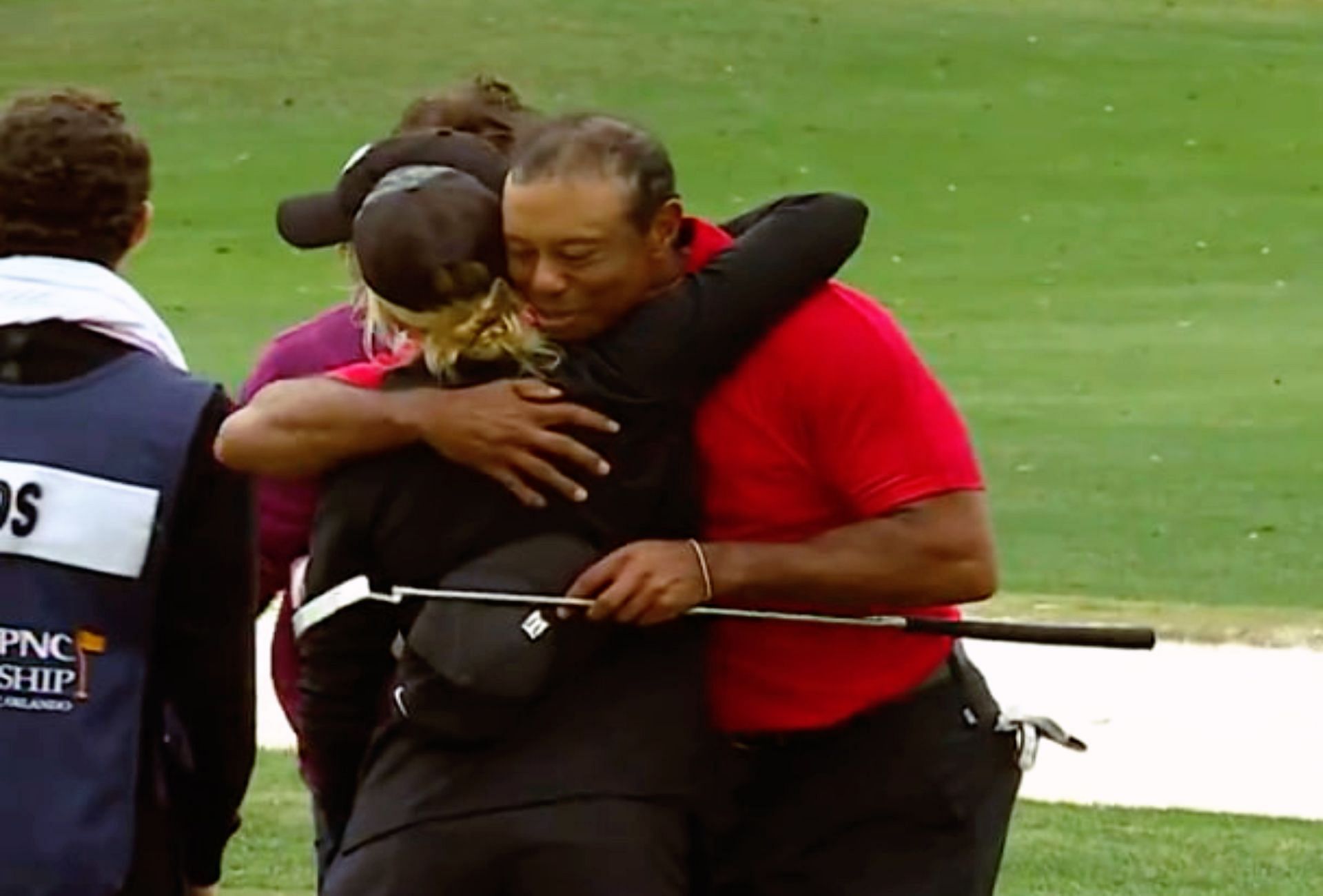 Tiger Woods hugging Izzi Stricker on the 18th hole of the second round, 2023 PNC Championship (Image via X @ChampionsTour).