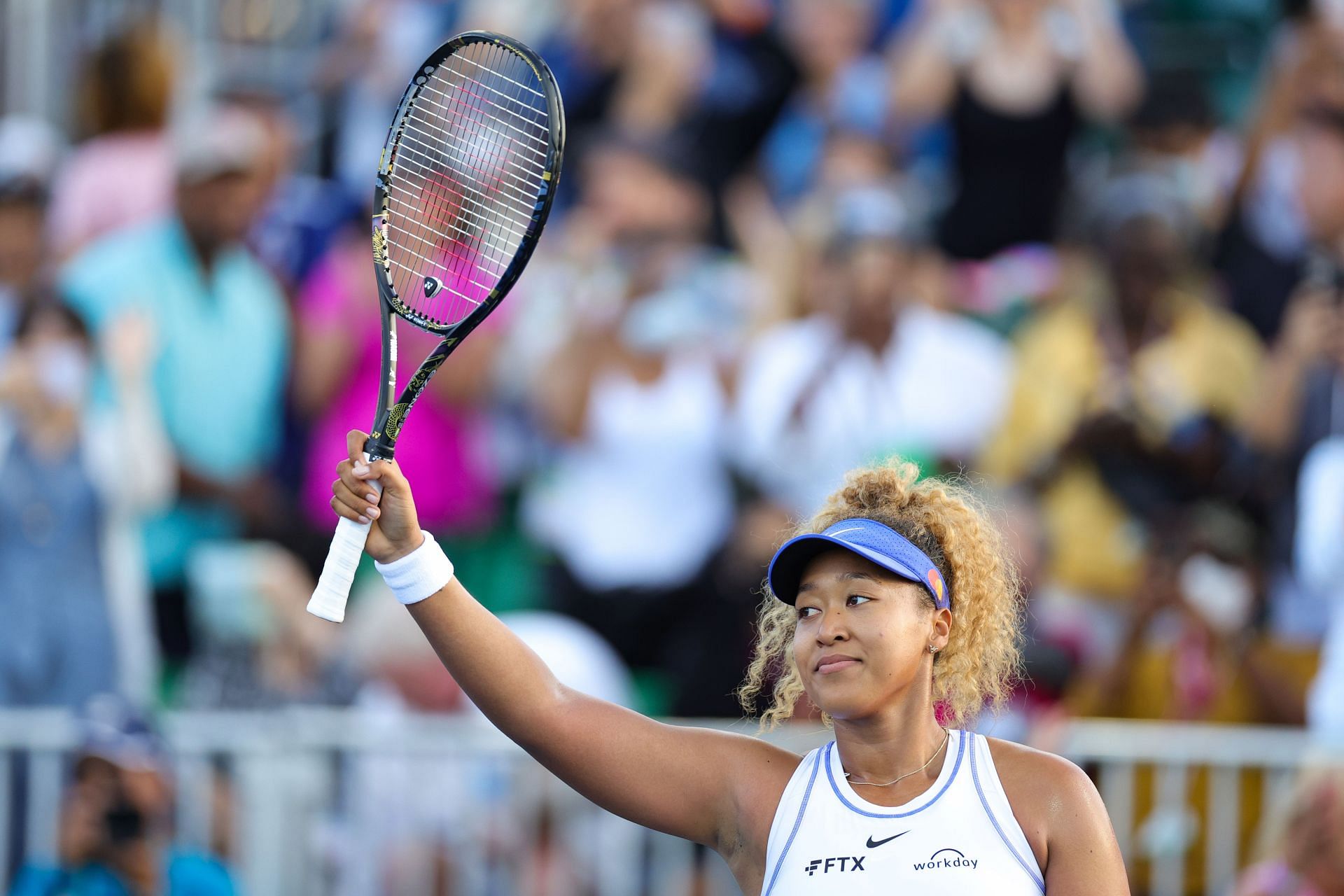 Naomi Osaka waves to spectators