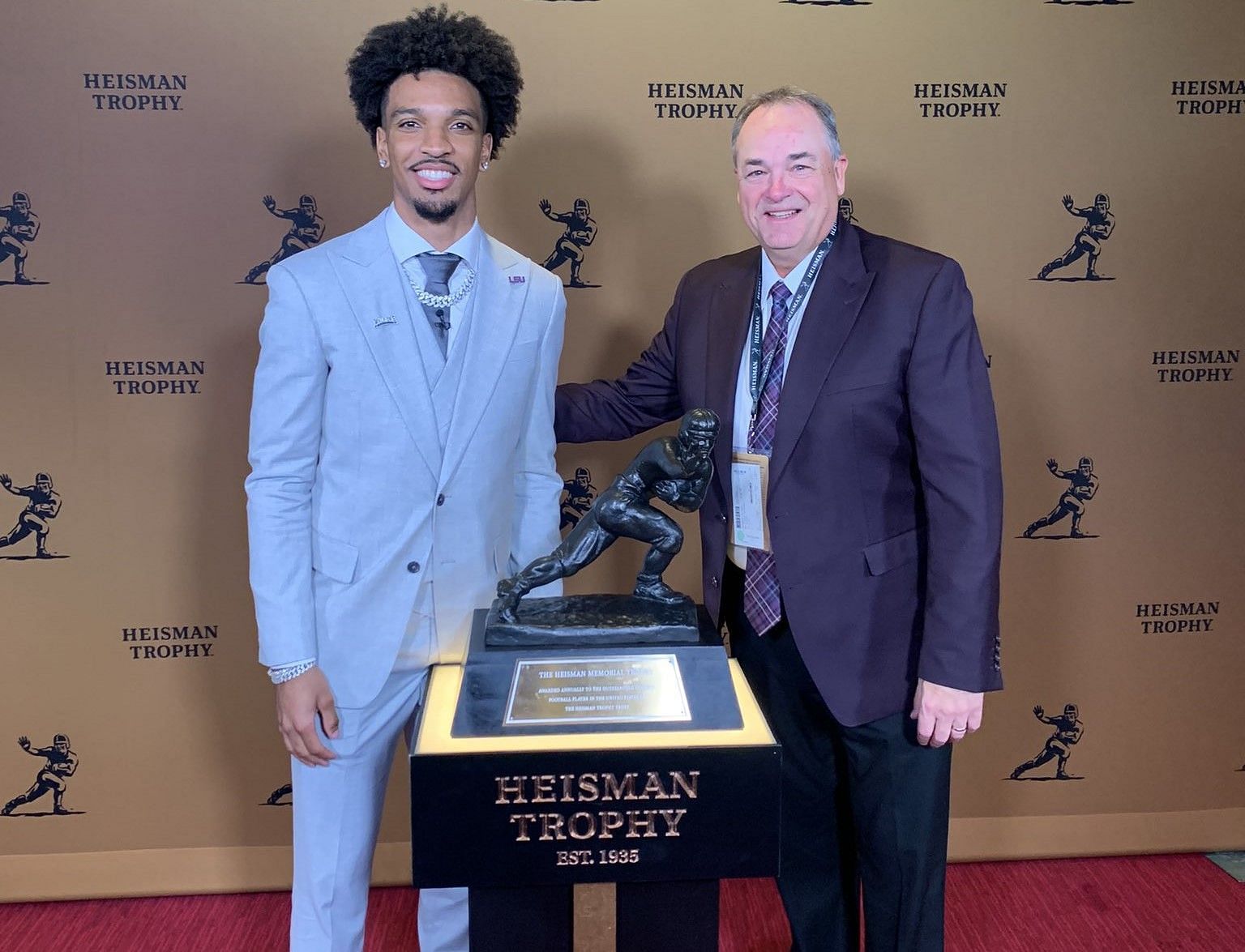 Mike Denbrock with Jayden Daniels at the Heisman Trophy ceremony [File Photo: Mike Denbrock