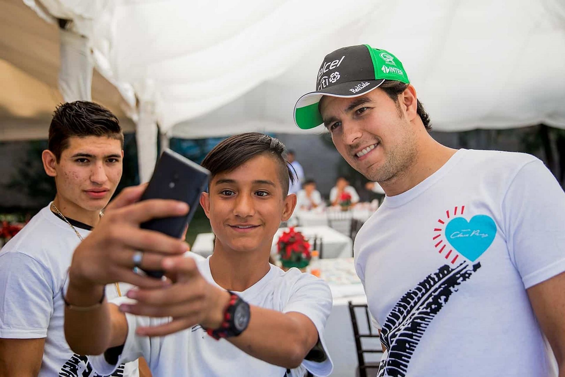 Sergio Perez meeting with children in his Foundation (Image via fundacionchecoperez.com)