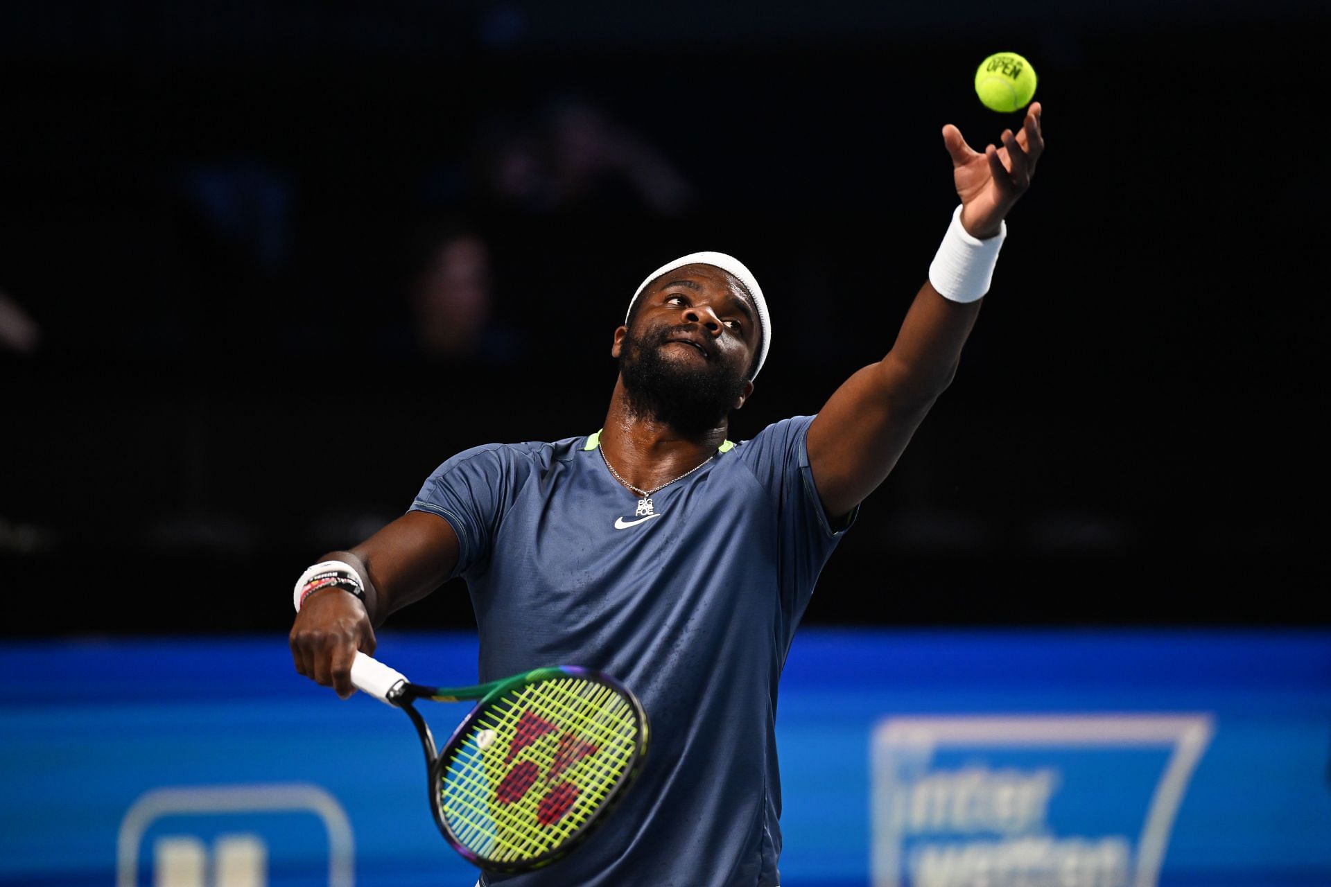 Frances Tiafoe of USA serves in his quarter-final match against Jannik Sinner of Italy - Getty Images