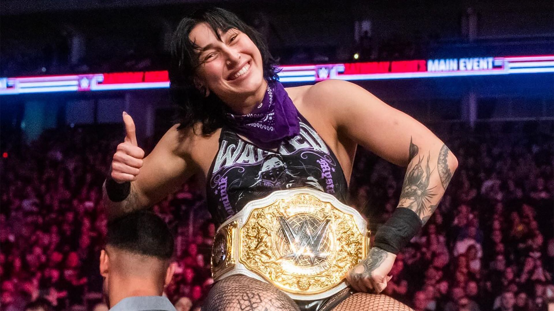 Rhea Ripley is all smiles with the WWE World Women