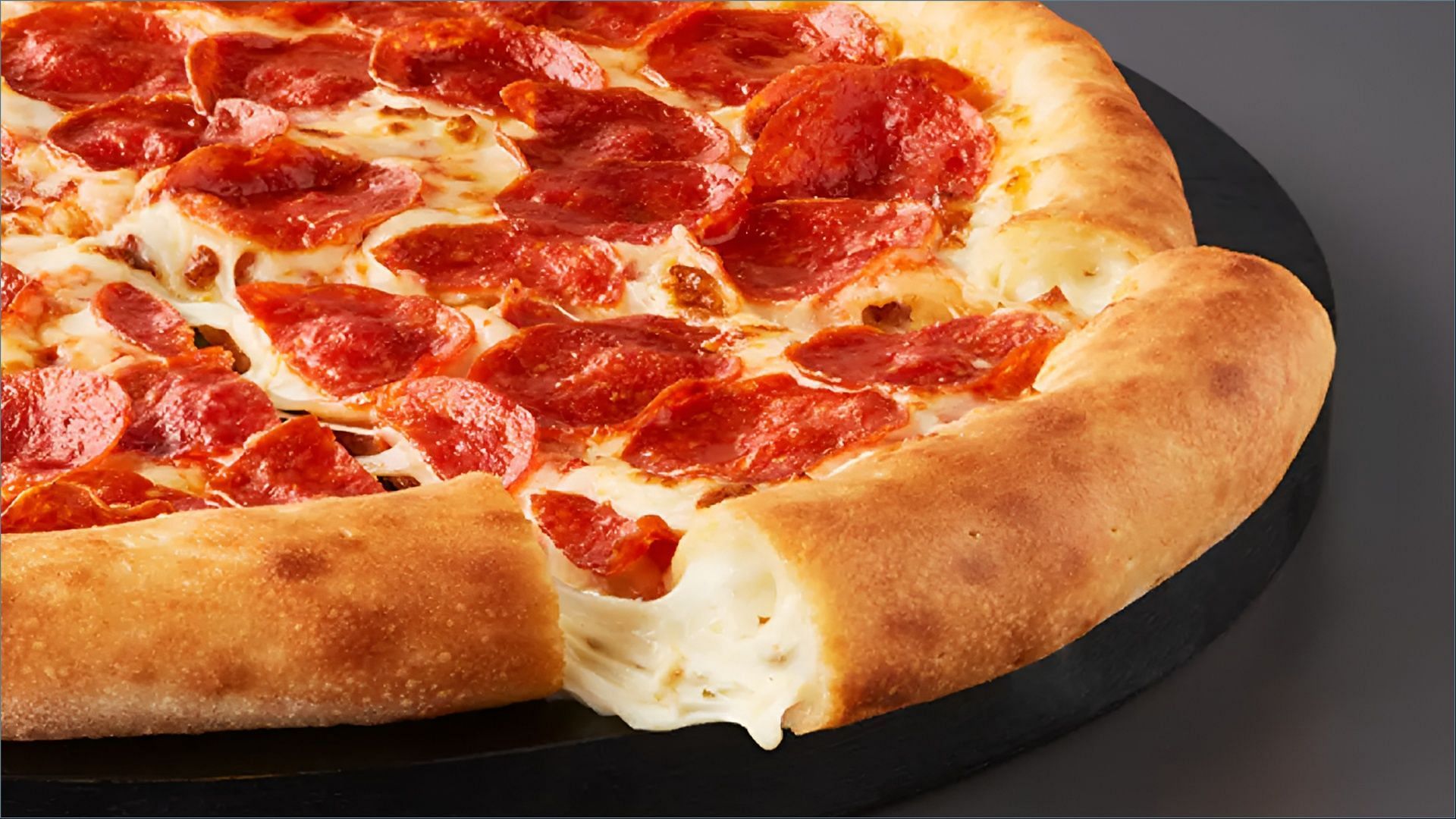 The new Cheesy Calzone Epic Stuffed Crust Pizza is priced at over $14.99 (Image via Papa Johns)