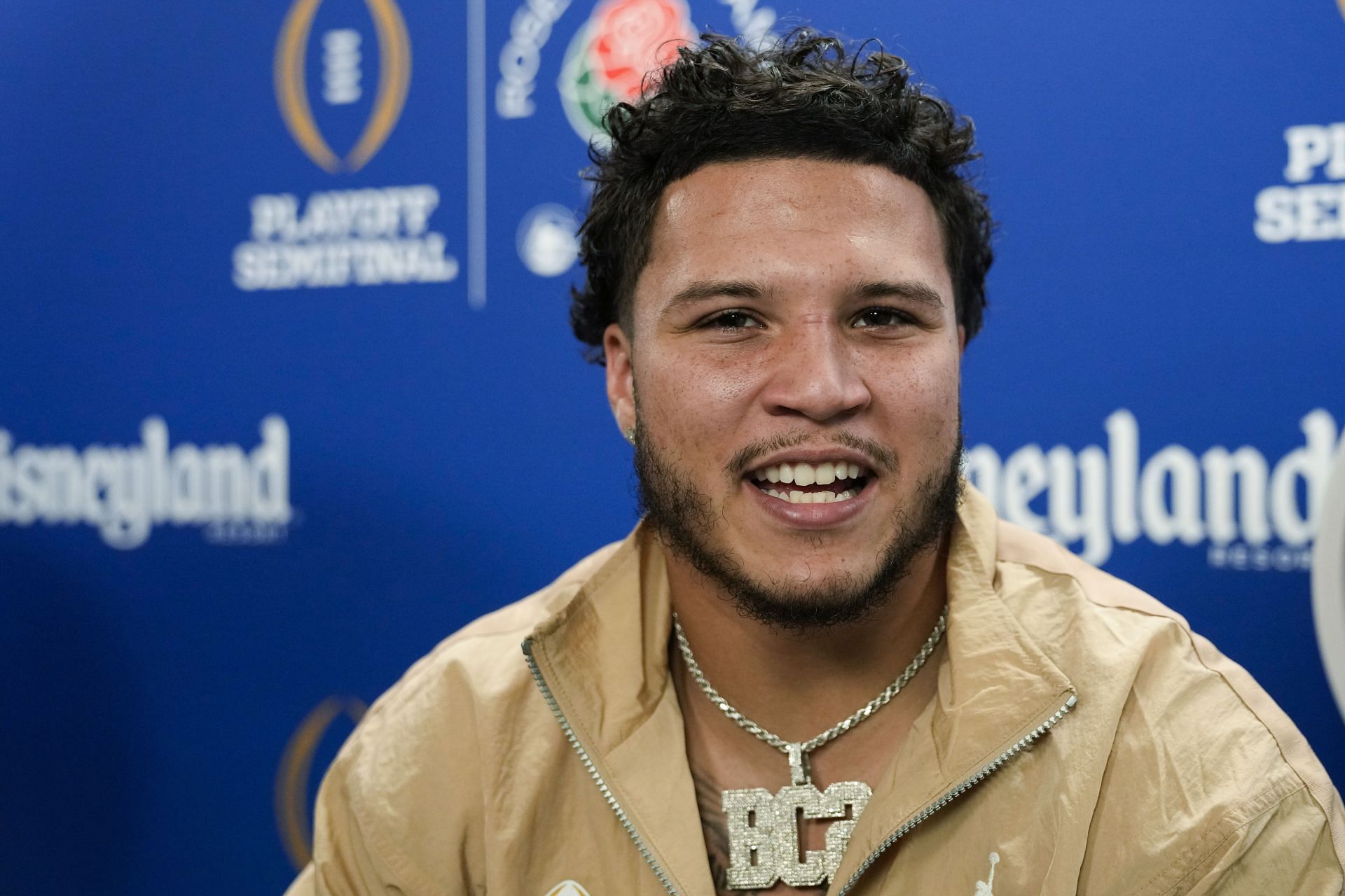 CFP Rose Bowl Michigan Football: Michigan running back Blake Corum listens during a welcome event for the team at Disneyland on Wednesday, Dec. 27, 2023, in Anaheim, Calif. Michigan is scheduled to play against Alabama on New Year's Day in the Rose Bowl, a semifinal in the College Football Playoff. (AP Photo/Ryan Sun)