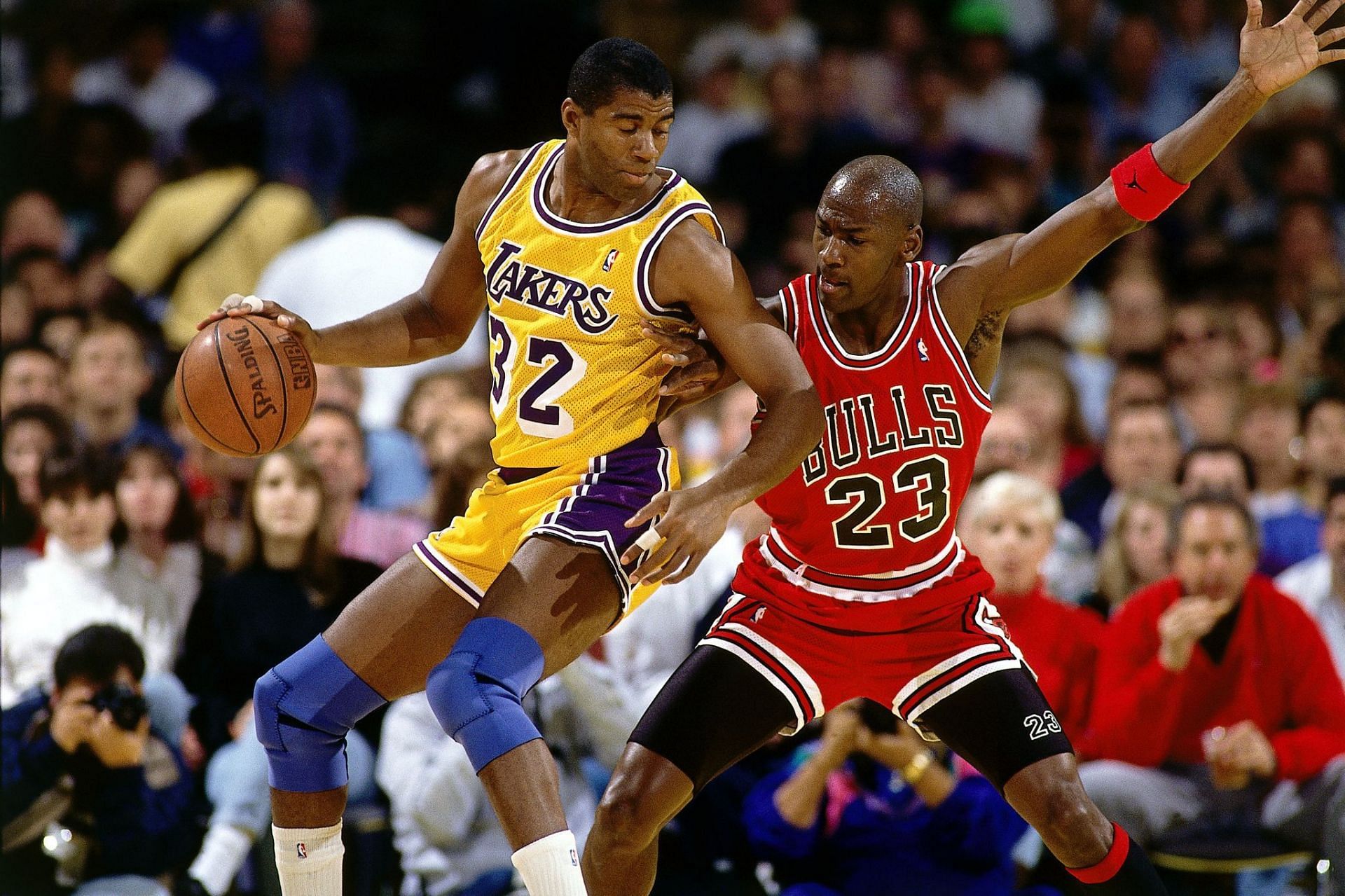 Magic Johnson vs Michael Jordan. EntPhoto Credit: Andrew D. Bernstein/NBAEer caption