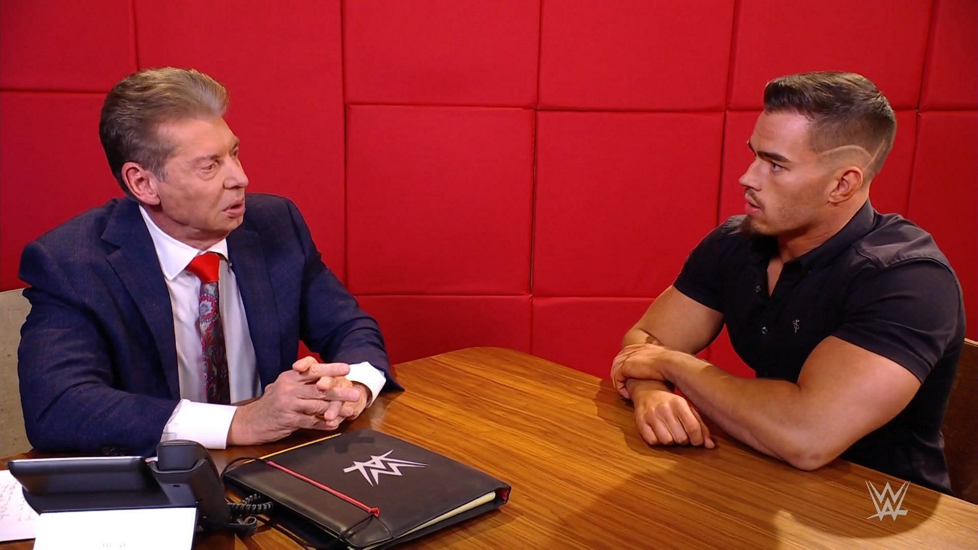 Vince McMahon having a serious discussion with Austin Theory on WWE programming