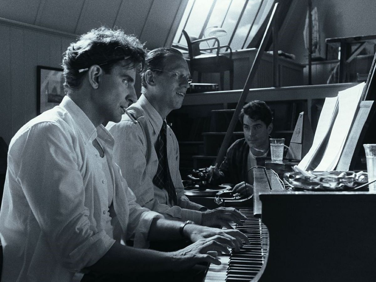 Bradley Cooper playing the piano in his latest film Maestro (image via Netflix)