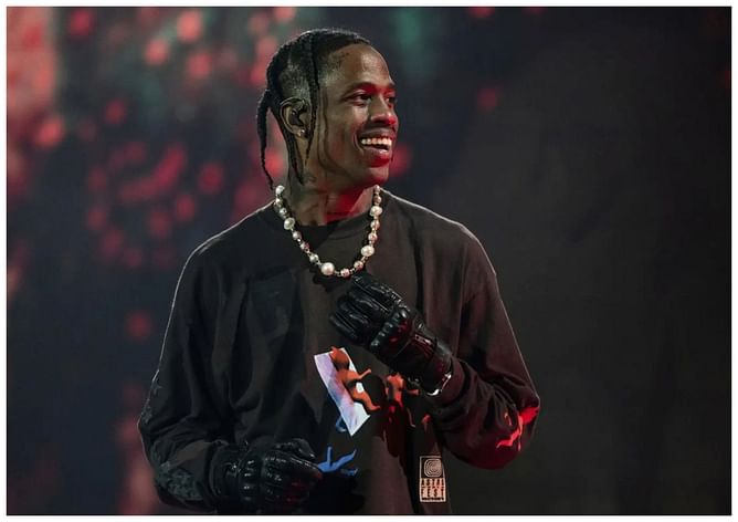 Travis Scott jokes about NBA players' ballhandling skills after his Cacti drink gets spilled at Barclays Center: 'Might not have the best hands'
