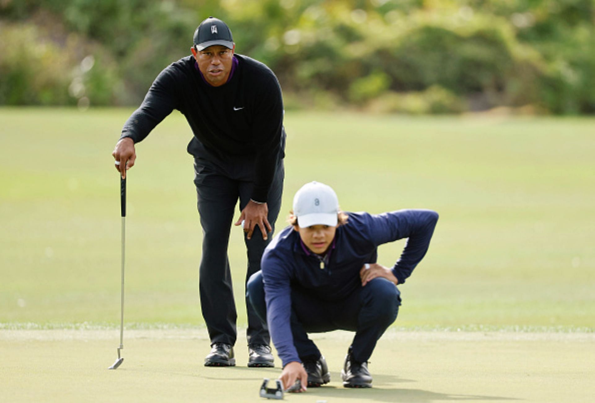 Tiger Woods and son Charlie (Image via Getty).