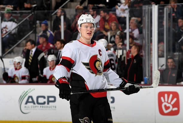 Brady Tkachuk of the Ottawa Senators gets ready during a face off against the Arizona Coyotes at Mullett Arena on December 19, 2023 in Tempe, Arizona.