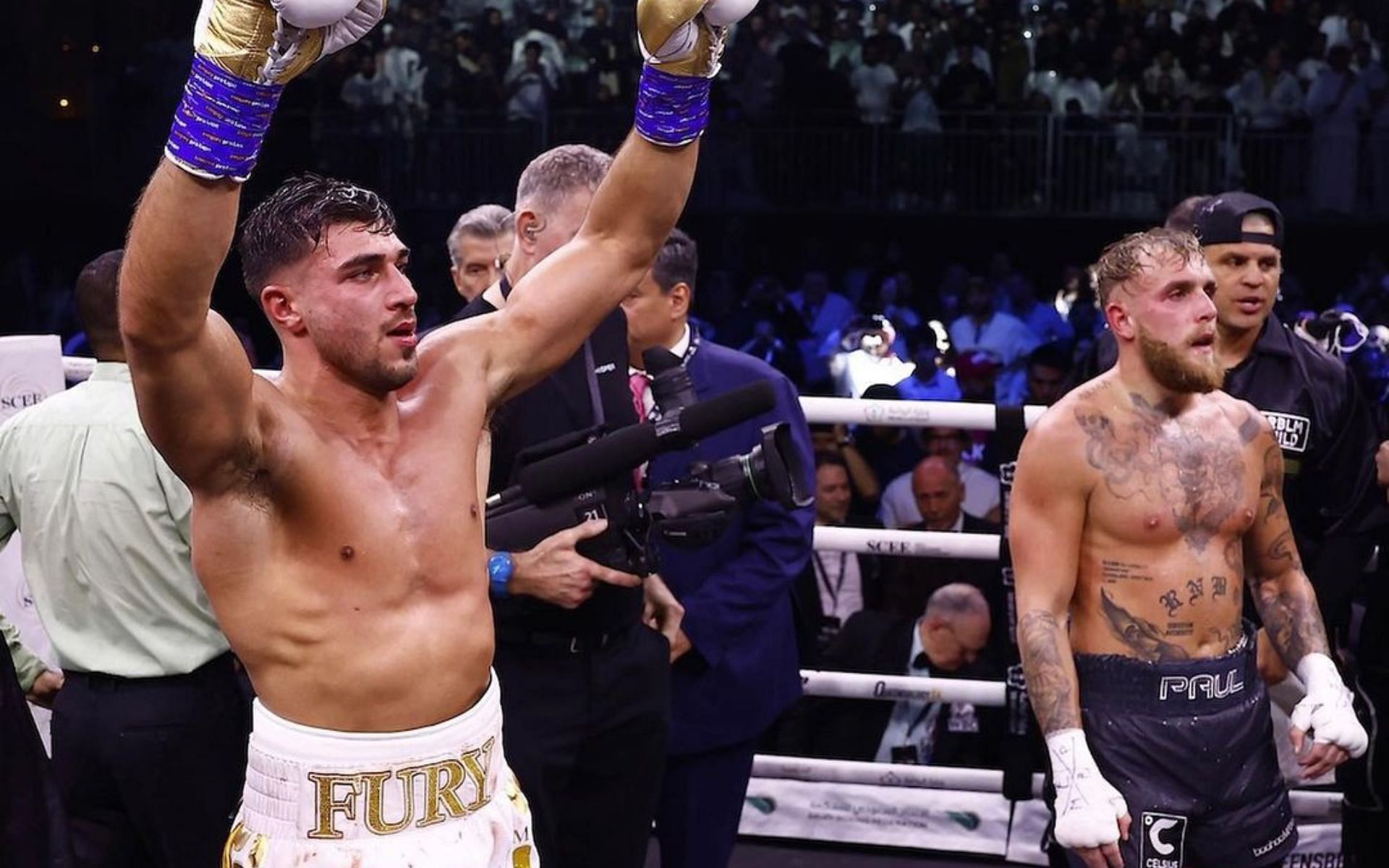 Tommy Fury (left) getting his hand raised after beating Jake Paul (right) (Images courtesy @tommyfury on Instagram)