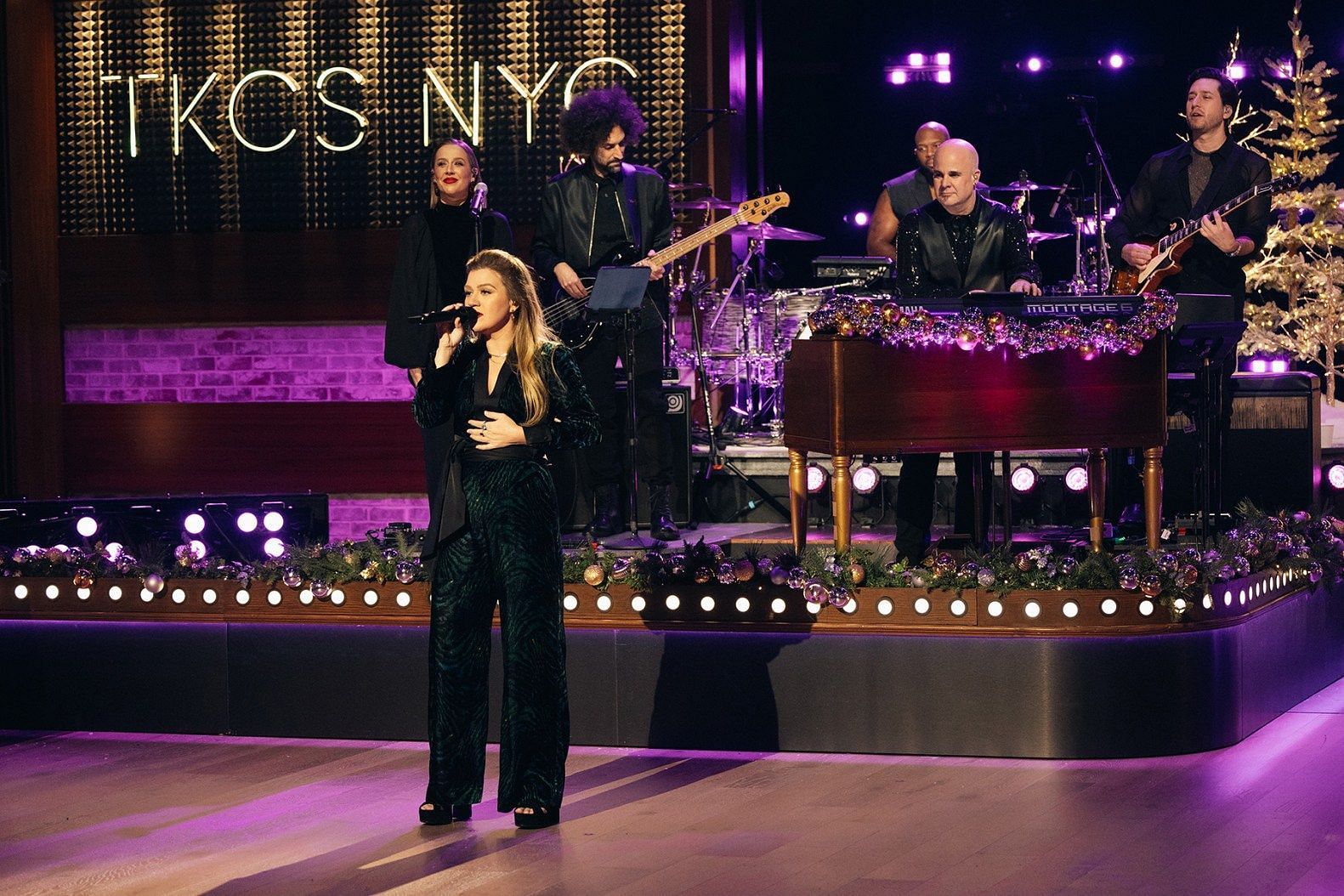 Clarkson performing the song (image via NBC)