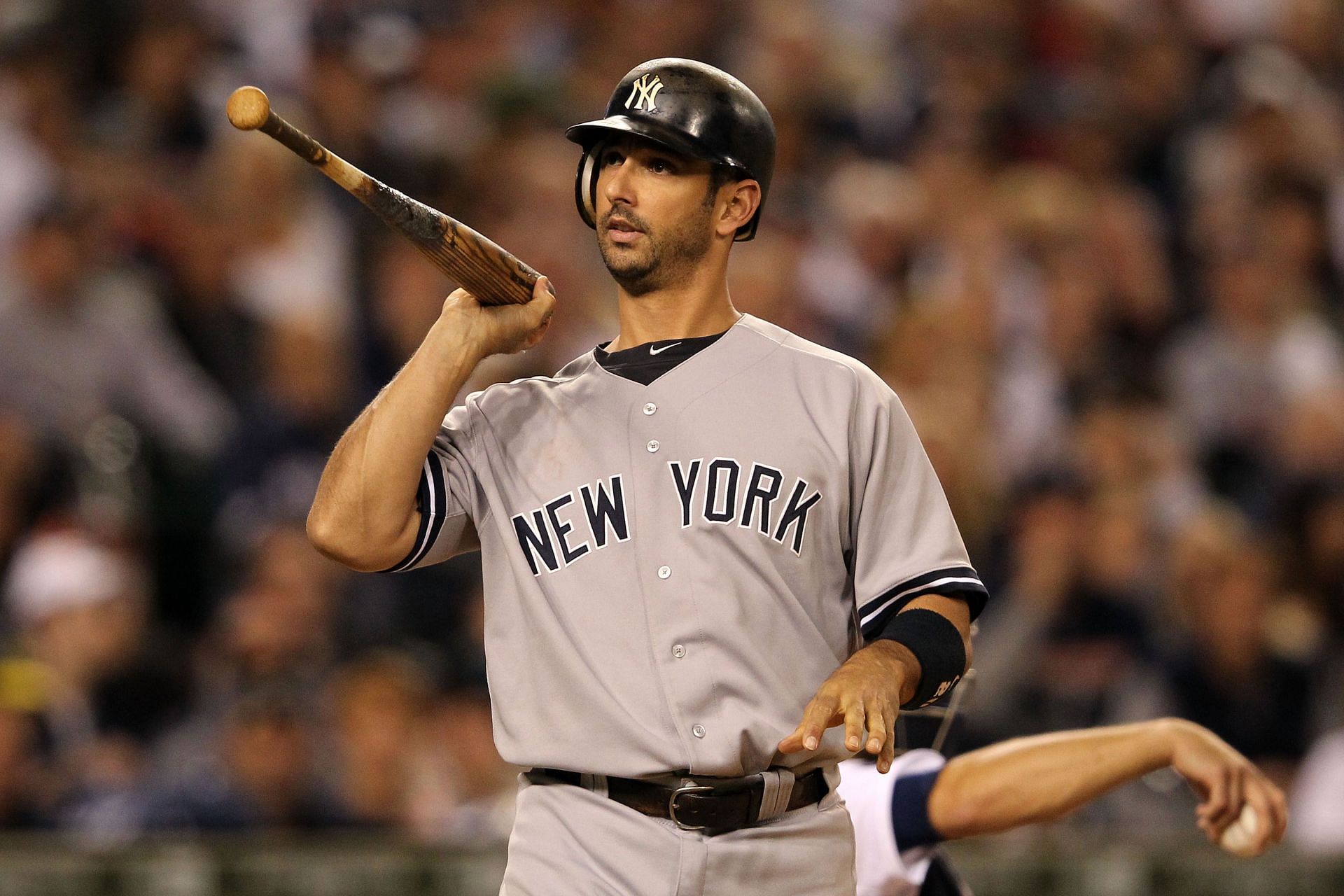 Jorge Posada #20 of the New York Yankees tosses his bat (2011)