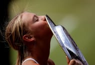 Maria Sharapova with the Wimbledon Championships trophy in 2004.