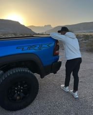 Garrett Wilson, along with his Ram 1500 TRX (image via Garrett Wilson’s Instagram)