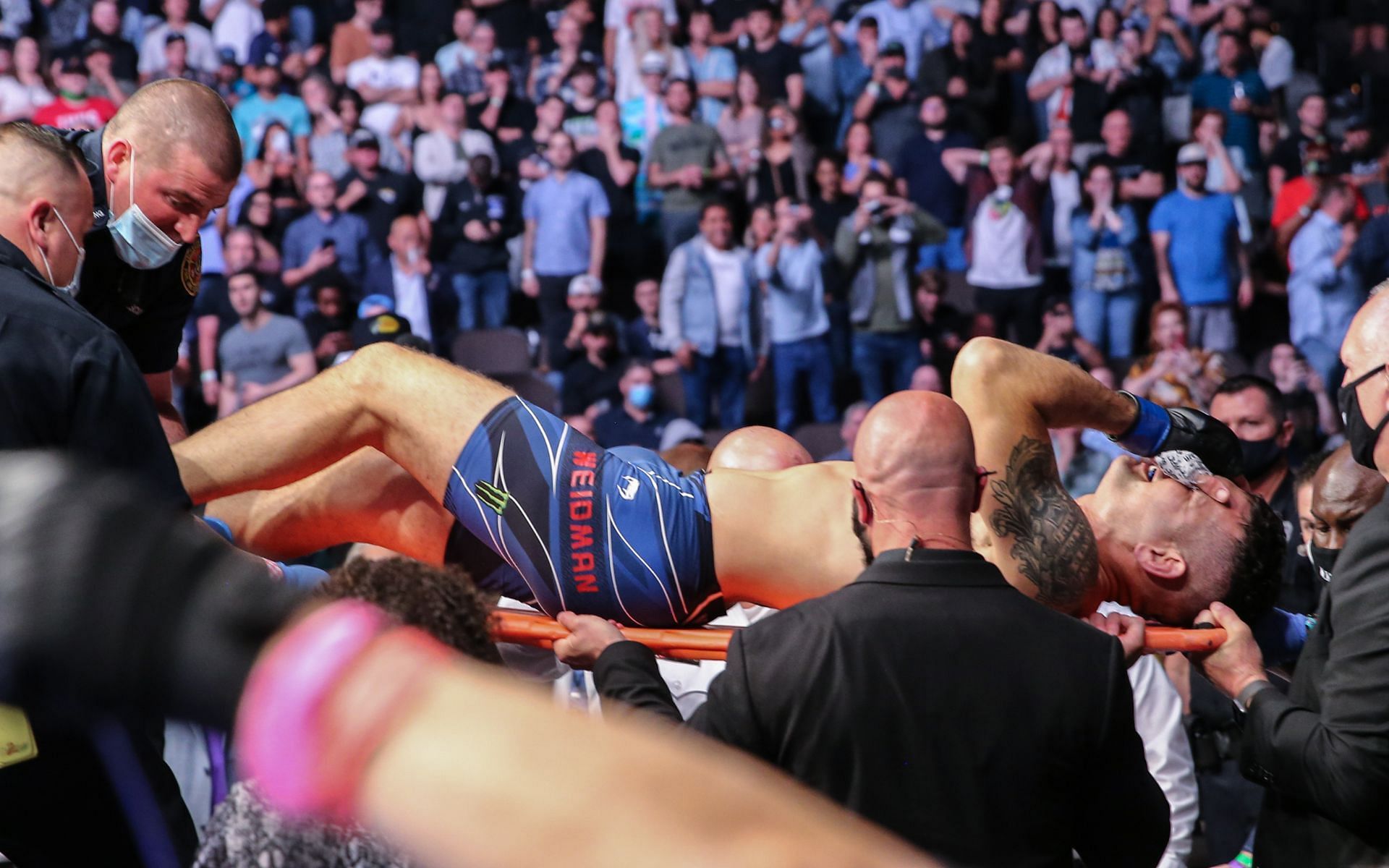 Chris Weidman was stretchered out and swiftly transported to a hospital after his horrific leg injury [Image courtesy: Getty Images]