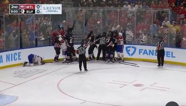 Justin Barron on the ice after being drilled into the boards by Eric Robinson of the Buffalo Sabres