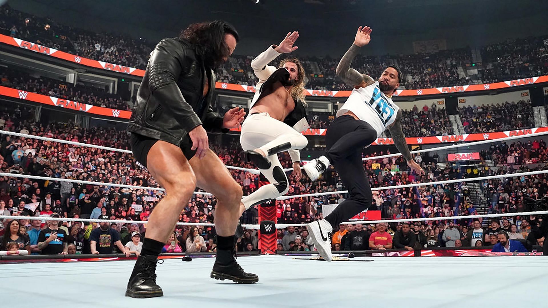 Seth Rollins and Jey Uso double team Drew McIntyre on WWE RAW