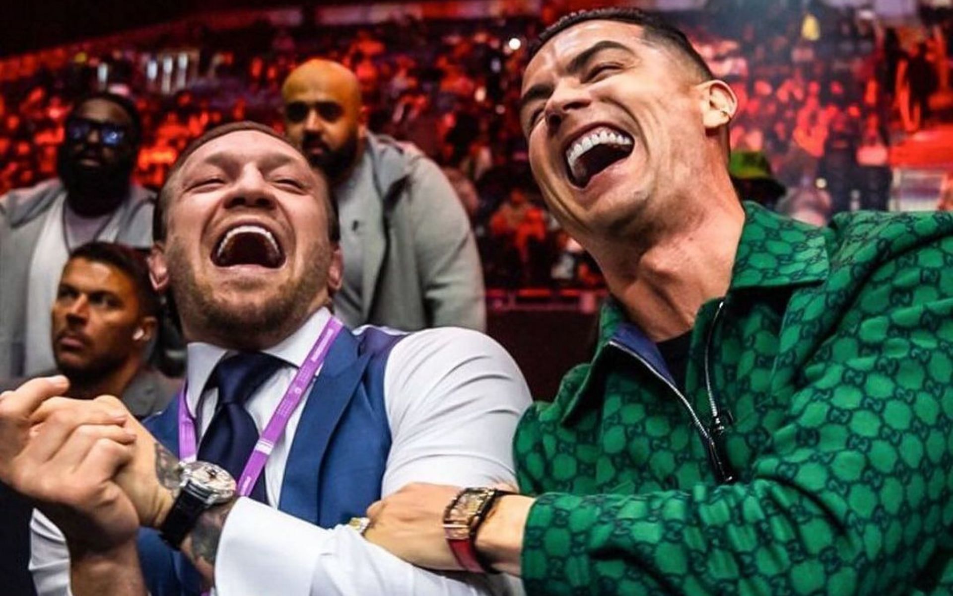 Conor McGregor (left) and Cristiano Ronaldo (right) sitting together ringside (Image courtesy @cristiano on Instagram)