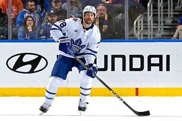 Brodie of the Toronto Maple Leafs skates with the puck against the New York Islanders at UBS Arena on December 11, 2023 in Elmont, New York.