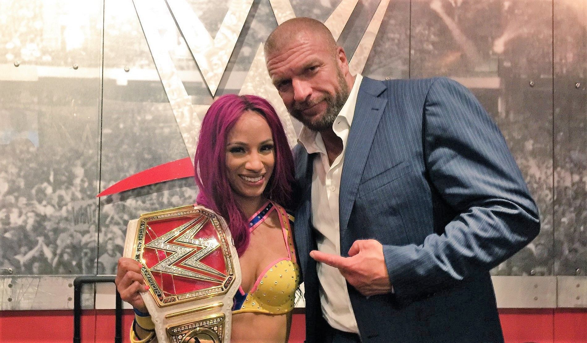 Sasha Banks with WWE Chief Content Officer Triple H