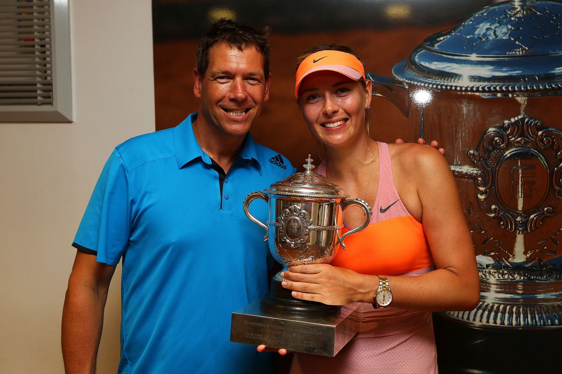 Sharapova with her coach after winning the 2014 French Open title