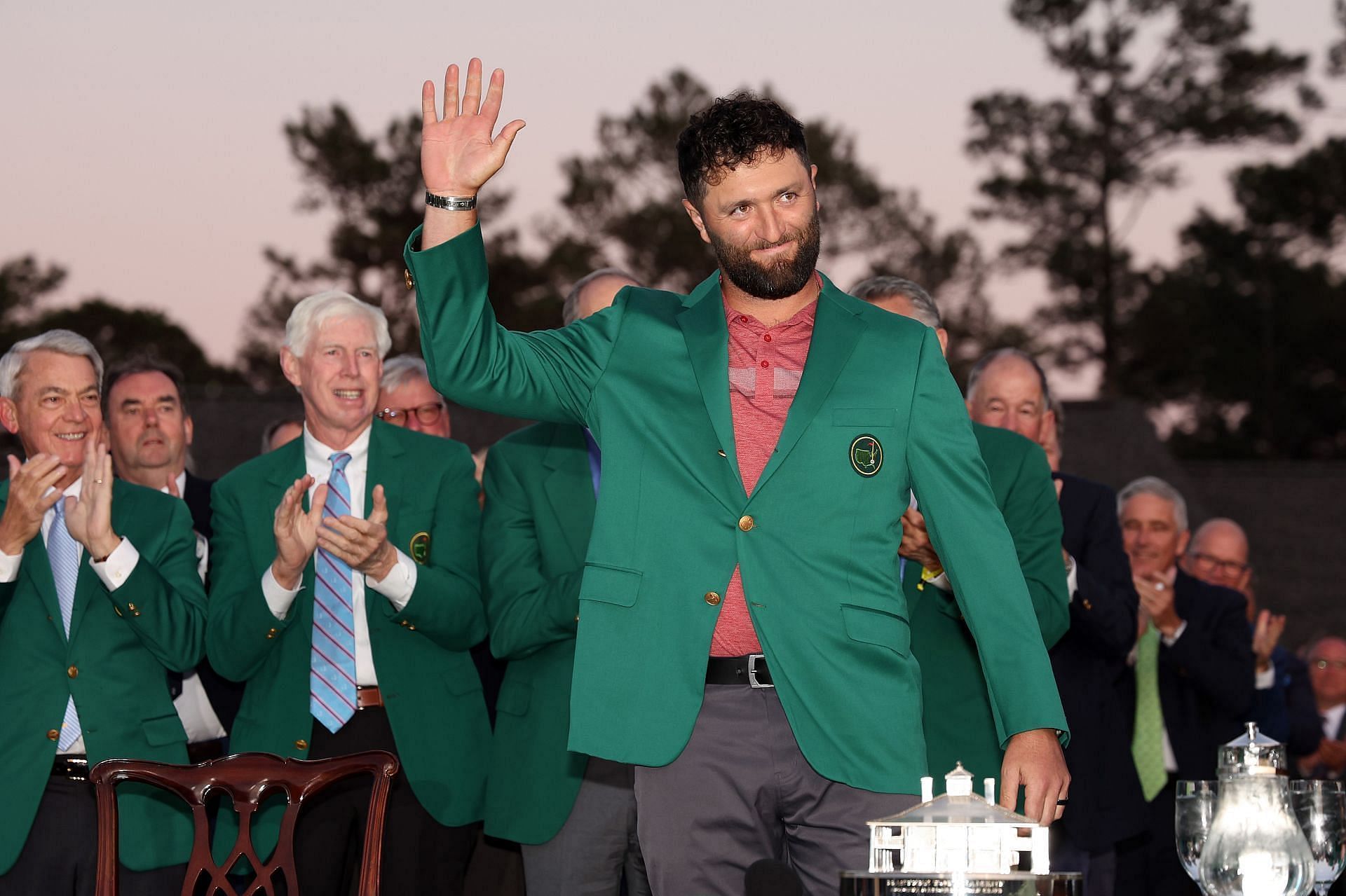 Jon Rahm waves after wearing the green jacket at the 2023 Masters