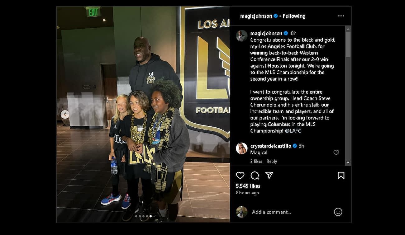 Magic Johnson posing with some kids who are rocking LAFC gear (Image via @magicjohnson)